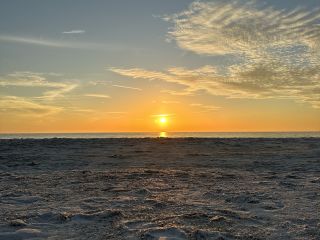 A sunset over a beach on Anna Maria Island